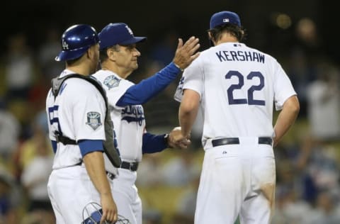 LOS ANGELES, CA - SEPTEMBER 02: Manager Joe Torre of the Los Angeles Dodgers pats starting pitcher Clayton Kershaw #22 on the back as he relieves him in the eighth inning with catcher Russell Martin #55 standing by against the San Diego Padres on September 2, 2008 at Dodger Stadiium in Los Angeles, California. (Photo by Stephen Dunn/Getty Images)