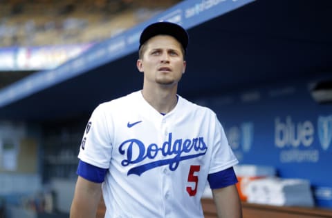 LOS ANGELES, CALIFORNIA - AUGUST 17: Corey Seager #5 of the Los Angeles Dodgers in the dugout prior to a game against the Pittsburgh Pirates at Dodger Stadium on August 17, 2021 in Los Angeles, California. (Photo by Michael Owens/Getty Images)