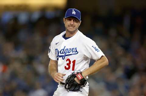 LOS ANGELES, CALIFORNIA - OCTOBER 11: Max Scherzer #31 of the Los Angeles Dodgers reacts after striking out LaMonte Wade Jr. #31 of the San Francisco Giants during the fourth inning in game 3 of the National League Division Series at Dodger Stadium on October 11, 2021 in Los Angeles, California. (Photo by Ronald Martinez/Getty Images)