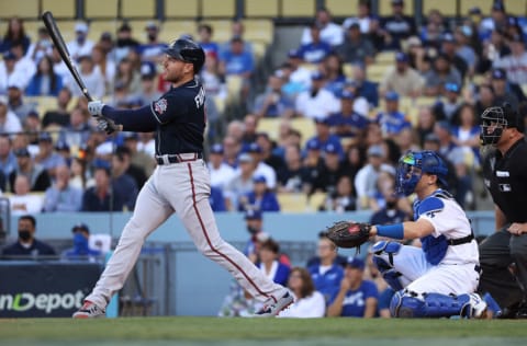 LOS ANGELES, CALIFORNIA - OCTOBER 21: Freddie Freeman #5 of the Atlanta Braves hits a two run home run during the first inning of Game Five of the National League Championship Series against the Los Angeles Dodgers at Dodger Stadium on October 21, 2021 in Los Angeles, California. (Photo by Harry How/Getty Images)