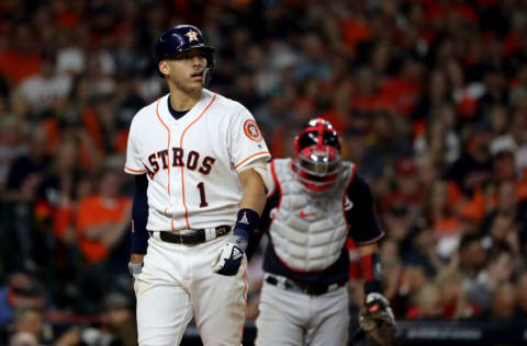 HOUSTON, TEXAS - OCTOBER 22: Carlos Correa #1 of the Houston Astros reacts after striking out against the Washington Nationals during the sixth inning in Game One of the 2019 World Series at Minute Maid Park on October 22, 2019 in Houston, Texas. (Photo by Elsa/Getty Images)