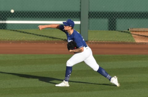 GOODYEAR, ARIZONA - MARCH 03: Bobby Miller #90 of the Los Angeles Dodgers prepares for a spring training game against the Cincinnati Reds at Camelback Ranch on March 03, 2021 in Goodyear, Arizona. (Photo by Norm Hall/Getty Images)