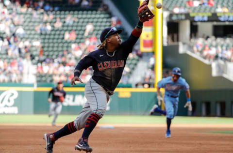 ARLINGTON, TEXAS - OCTOBER 03: Jose Ramirez #11 of the Cleveland Indians fields a ball in the third inning and forces the runner out at third against the Texas Rangers at Globe Life Field on October 03, 2021 in Arlington, Texas. (Photo by Tim Warner/Getty Images)