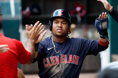 ARLINGTON, TEXAS – OCTOBER 03: Jose Ramirez #11 of the Cleveland Indians is greeted by teammates after scoring a run in the third inning against the Texas Rangers at Globe Life Field on October 03, 2021 in Arlington, Texas. (Photo by Tim Warner/Getty Images)