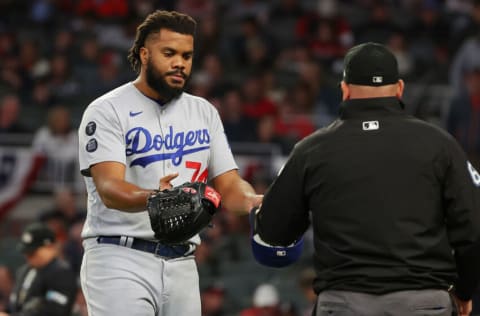 ATLANTA, GEORGIA - OCTOBER 16: Kenley Jansen #74 of the Los Angeles Dodgers is checked for foreign substances against the Atlanta Braves during the eighth inning of Game One of the National League Championship Series at Truist Park on October 16, 2021 in Atlanta, Georgia. (Photo by Kevin C. Cox/Getty Images)