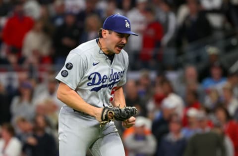 ATLANTA, GEORGIA - OCTOBER 17: Alex Vesia #51 of the Los Angeles Dodgers reacts after the final out against the Atlanta Braves of the fifth inning of Game Two of the National League Championship Series at Truist Park on October 17, 2021 in Atlanta, Georgia. (Photo by Kevin C. Cox/Getty Images)