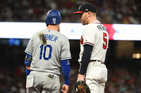 ATLANTA, GEORGIA - AUGUST 17: Freddie Freeman #5 of the Atlanta Braves talks to Justin Turner #10 of the Los Angeles Dodgers at SunTrust Park on August 17, 2019 in Atlanta, Georgia. (Photo by Logan Riely/Getty Images)