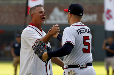 ATLANTA, GEORGIA - OCTOBER 03: Former Atlanta Braves player Chipper Jones shakes hands with Freddie Freeman #5 of the Atlanta Braves after throwing out the ceremonial first pitch prior to game one of the National League Division Series between the Atlanta Braves and the St. Louis Cardinals at SunTrust Park on October 03, 2019 in Atlanta, Georgia. (Photo by Kevin C. Cox/Getty Images)