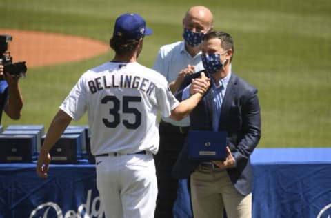 LOS ANGELES, CALIFORNIA - APRIL 09: Cody Bellinger #35 of the Los Angeles Dodgers receives his World Series ring from President, Baseball Operations Andrew Friedman prior to the game against the Washington Nationals at Dodger Stadium on April 09, 2021 in Los Angeles, California. (Photo by Harry How/Getty Images)