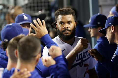 LOS ANGELES, CALIFORNIA - OCTOBER 06: Teammates greet Kenley Jansen #74 of the Los Angeles Dodgers in the dugout after the top of the ninth inning against the St. Louis Cardinals during the National League Wild Card Game at Dodger Stadium on October 06, 2021 in Los Angeles, California. (Photo by Sean M. Haffey/Getty Images)