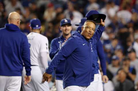 LOS ANGELES, CALIFORNIA - OCTOBER 06: Dave Roberts #30 of the Los Angeles Dodgers celebrates their 3 to 1 win over the St. Louis Cardinals in the National League Wild Card Game at Dodger Stadium on October 06, 2021 in Los Angeles, California. (Photo by Sean M. Haffey/Getty Images)