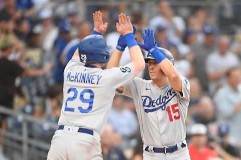 Austin Barnes #15 of the Los Angeles Dodgers, right, is congratulated by Billy McKinney #29 (Photo by Denis Poroy/Getty Images)