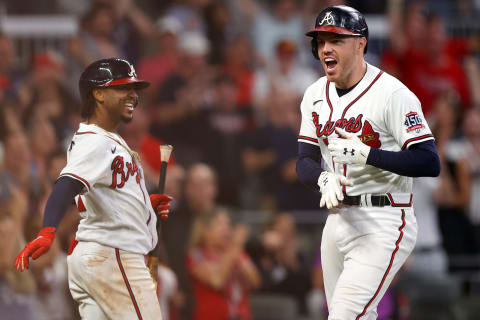 ATLANTA, GEORGIA – OCTOBER 12: Freddie Freeman #5 of the Atlanta Braves celebrates with Ozzie Albies #1 after hitting a home run during the eighth inning against the Milwaukee Brewers in game four of the National League Division Series at Truist Park on October 12, 2021 in Atlanta, Georgia. (Photo by Todd Kirkland/Getty Images)