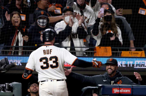 SAN FRANCISCO, CALIFORNIA - OCTOBER 14: Darin Ruf #33 and manager Gabe Kapler #19 of the San Francisco Giants celebrate Ruf's solo home run against the Los Angeles Dodgers during the sixth inning in game 5 of the National League Division Series at Oracle Park on October 14, 2021 in San Francisco, California. (Photo by Harry How/Getty Images)