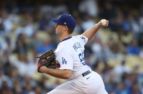 LOS ANGELES, CALIFORNIA - OCTOBER 21: Evan Phillips #59 of the Los Angeles Dodgers throws a pitch during the first inning of Game Five of the National League Championship Series against the Atlanta Braves at Dodger Stadium on October 21, 2021 in Los Angeles, California. (Photo by Ronald Martinez/Getty Images)