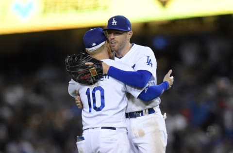 LOS ANGELES, CA - APRIL 18: Freddie Freeman #5 of the Los Angeles Dodgers celebrates with Justin Turner #10 after defeating the Atlanta Braves, 7-4, at Dodger Stadium on April 18, 2022 in Los Angeles, California. (Photo by Kevork Djansezian/Getty Images)