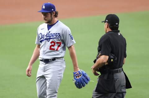 SAN DIEGO, CALIFORNIA - JUNE 23: Umpire James Hoye #92 walks toward Trevor Bauer #27 of the Los Angeles Dodgers to check for foreign substances during the first inning of a game against the San Diego Padres at PETCO Park on June 23, 2021 in San Diego, California. (Photo by Sean M. Haffey/Getty Images)