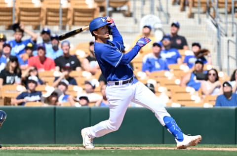 GLENDALE, ARIZONA - MARCH 23: Miguel Vargas #71 of the Los Angeles Dodgers follows through on a swing against the Cleveland Guardians during a spring training game at Camelback Ranch on March 23, 2022 in Glendale, Arizona. (Photo by Norm Hall/Getty Images)