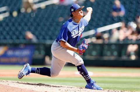 SURPRISE, ARIZONA - MARCH 31: Relief pitcher Victor Gonzalez #81of the Los Angeles Dodgers pitches against the Texas Rangers during the third inning of the MLB spring training game at Surprise Stadium on March 31, 2022 in Surprise, Arizona. (Photo by Christian Petersen/Getty Images)