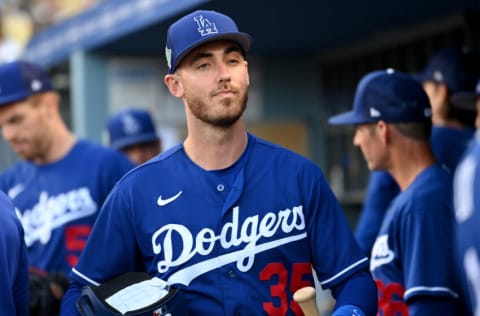 LOS ANGELES, CA - APRIL 5; Cody Bellinger #35 of the Los Angeles Dodgers gets ready in the dugout before a preseason game against the Los Angeles Angels at Dodger Stadium on April 5, 2022 in Los Angeles, California. (Photo by Jayne Kamin-Oncea/Getty Images)