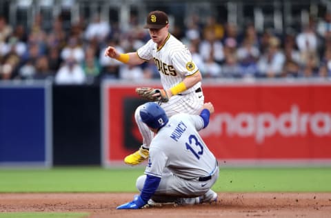 SAN DIEGO, CALIFORNIA - APRIL 22: Max Muncy #13 is forced out at second base on a fielders choice hit by Justin Turner #10 of the Los Angeles Dodgers as Jake Cronenworth #9 of the San Diego Padres makes the play during the first inning of a game at PETCO Park on April 22, 2022 in San Diego, California. (Photo by Sean M. Haffey/Getty Images)