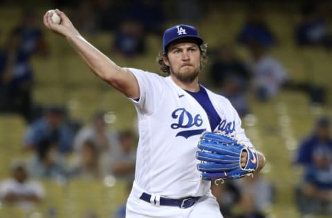 LOS ANGELES, CALIFORNIA - JUNE 12: Trevor Bauer #27 of the Los Angeles Dodgers throws the ball to first base during the fifth inning against the Texas Rangers at Dodger Stadium on June 12, 2021 in Los Angeles, California. (Photo by Katelyn Mulcahy/Getty Images)