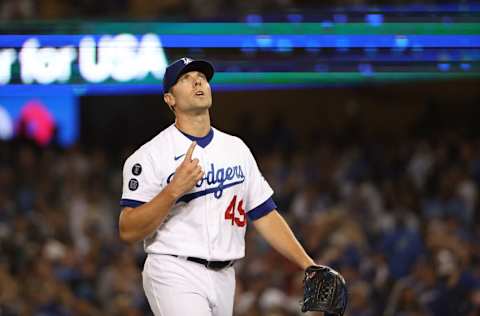 LOS ANGELES, CALIFORNIA - OCTOBER 21: Blake Treinen #49 of the Los Angeles Dodgers reacts to the third out during the sixth inning of Game Five of the National League Championship Series against the Atlanta Braves at Dodger Stadium on October 21, 2021 in Los Angeles, California. (Photo by Harry How/Getty Images)