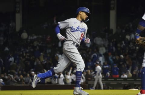 CHICAGO, ILLINOIS - MAY 07: Mookie Betts #50 of the Los Angeles Dodgers hits a home run during the ninth inning of Game Two of a doubleheader against the Chicago Cubs at Wrigley Field on May 07, 2022 in Chicago, Illinois. The Dodgers defeated the Cubs 6-2. (Photo by Nuccio DiNuzzo/Getty Images)