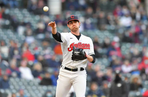 CLEVELAND, OHIO - MAY 11: Starting pitcher Shane Bieber #57 of the Cleveland Indians throws out Ildemaro Vargas #16 of the Chicago Cubs at first base during the sixth inning at Progressive Field on May 11, 2021 in Cleveland, Ohio. (Photo by Jason Miller/Getty Images)