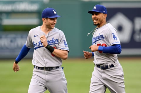 WASHINGTON, DC - MAY 23: Trea Turner #6 and Mookie Betts #50 of the Los Angeles Dodgers warm up before the game against the Washington Nationals at Nationals Park on May 23, 2022 in Washington, DC. (Photo by G Fiume/Getty Images)