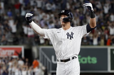 NEW YORK, NEW YORK - JUNE 23: Aaron Judge #99 of the New York Yankees celebrates his ninth inning game winning base hit against the Houston Astros at Yankee Stadium on June 23, 2022 in New York City. The Yankees defeated the Astros 7-6. (Photo by Jim McIsaac/Getty Images)