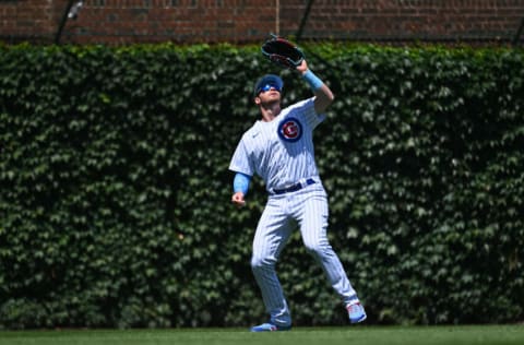 CHICAGO, IL - JUNE 19: Ian Happ #8 of the Chicago Cubs fields a fly ball against the Atlanta Braves at Wrigley Field on June 19, 2022 in Chicago, Illinois. (Photo by Jamie Sabau/Getty Images)