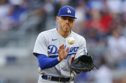 ATLANTA, GA - JUNE 26: Freddie Freeman #5 of the Los Angeles Dodgers takes the toss at first for an out during the second inning against the Atlanta Braves at Truist Park on June 26, 2022 in Atlanta, Georgia. (Photo by Todd Kirkland/Getty Images)