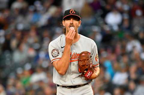 SEATTLE, WASHINGTON - JUNE 28: Dean Kremer #64 of the Baltimore Orioles licks his fingers during the fourth inning against the Seattle Mariners at T-Mobile Park on June 28, 2022 in Seattle, Washington. (Photo by Alika Jenner/Getty Images)