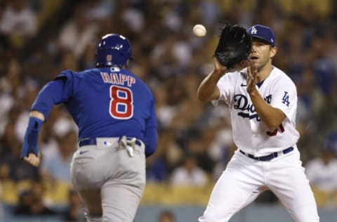 LOS ANGELES, CALIFORNIA - JULY 08: Tyler Anderson #31 of the Los Angeles Dodgers catches Ian Happ #8 of the Chicago Cubs in a run down at home plate during the fifth inning at Dodger Stadium on July 08, 2022 in Los Angeles, California. (Photo by Michael Owens/Getty Images)