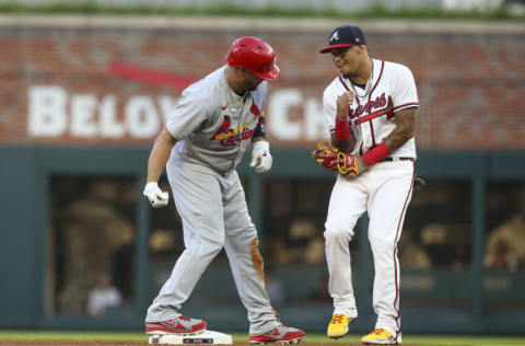 ATLANTA, GA - JULY 06: Albert Pujols #5 of the St. Louis Cardinals jokes with Orlando Arcia #11 of the Atlanta Braves after a double in the fourth inning at Truist Park on July 6, 2022 in Atlanta, Georgia. (Photo by Brett Davis/Getty Images)