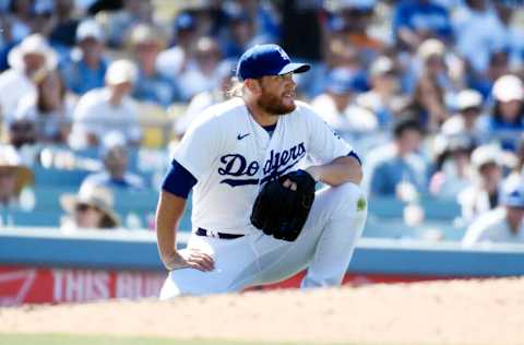 LOS ANGELES, CA - JULY 03: Closer Craig Kimbrel #46 of the Los Angeles Dodgers reacts after getting hit in the lower back by a ball off the bat of Jake Cronenworth #9 of the San Diego Padres during the ninth inning at Dodger Stadium on July 3, 2022 in Los Angeles, California. Kimbrel was replaced after blowing a save following his injury. Padres win, 4-2. (Photo by Kevork Djansezian/Getty Images)