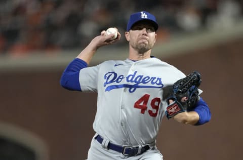 SAN FRANCISCO, CALIFORNIA - OCTOBER 14: Blake Treinen #49 of the Los Angeles Dodgers pitches against the San Francisco Giants during the seventh inning in game 5 of the National League Division Series at Oracle Park on October 14, 2021 in San Francisco, California. (Photo by Thearon W. Henderson/Getty Images)