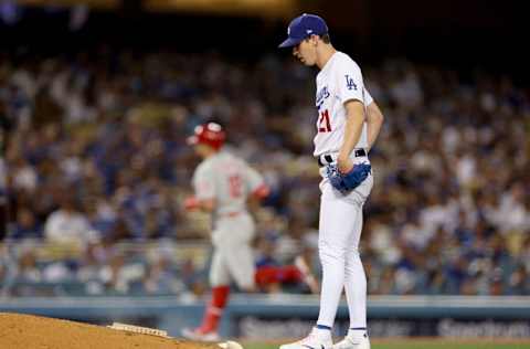 LOS ANGELES, CALIFORNIA - MAY 13: Walker Buehler #21 of the Los Angeles Dodgers reacts to a two run homerun from Kyle Schwarber #12 of the Philadelphia Phillies, to tie the game 2-2 during the fourth inning at Dodger Stadium on May 13, 2022 in Los Angeles, California. (Photo by Harry How/Getty Images)