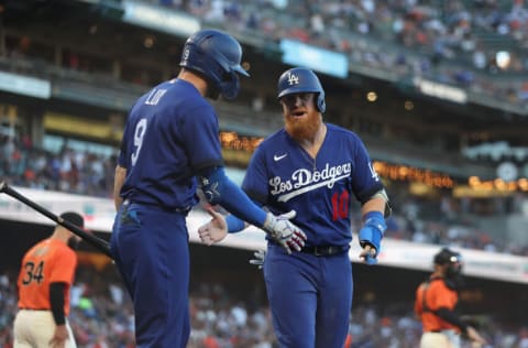 SAN FRANCISCO, CALIFORNIA - JUNE 10: Justin Turner #10 of the Los Angeles Dodgers celebrates with Gavin Lux #9 after scoring in the top of the second inning against the San Francisco Giants at Oracle Park on June 10, 2022 in San Francisco, California. (Photo by Lachlan Cunningham/Getty Images)