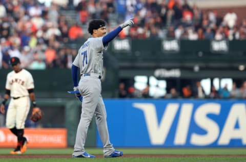 SAN FRANCISCO, CALIFORNIA - AUGUST 03: Miguel Antonio Vargas #71 of the Los Angeles Dodgers reacts after he hit a double on his first Major League at-bat in the second inning against the San Francisco Giants at Oracle Park on August 03, 2022 in San Francisco, California. Vargas made his Major League Baseball debut tonight. (Photo by Ezra Shaw/Getty Images)