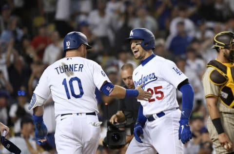 LOS ANGELES, CA - SEPTEMBER 04: Trayce Thompson #25 of the Los Angeles Dodgers is congratulated at home plate by Justin Turner #10 after hitting a three-run home run against relief pitcher Adrian Morejon #50 of the San Diego Padres during the seventh inning at Dodger Stadium on September 4, 2022 in Los Angeles, California. (Photo by Kevork Djansezian/Getty Images)