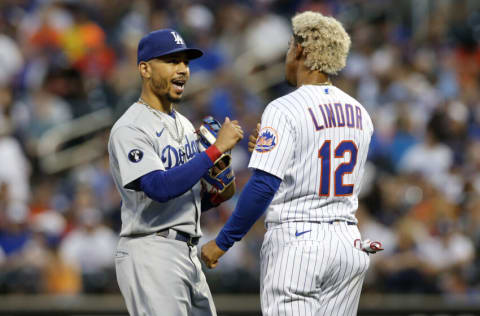 NEW YORK, NEW YORK - AUGUST 31: Mookie Betts #50 of the Los Angeles Dodgers talks with Francisco Lindor #12 of the New York Mets after the first inning at Citi Field on August 31, 2022 in New York City. (Photo by Jim McIsaac/Getty Images)