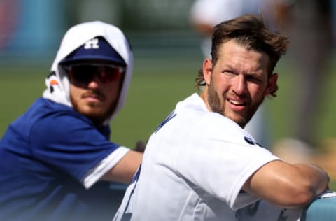 LOS ANGELES, CALIFORNIA - SEPTEMBER 07: Clayton Kershaw #22 and Cody Bellinger #35 of the Los Angeles Dodgers look out from the dugout during the sixth inning against the San Francisco Giants at Dodger Stadium on September 07, 2022 in Los Angeles, California. (Photo by Harry How/Getty Images)