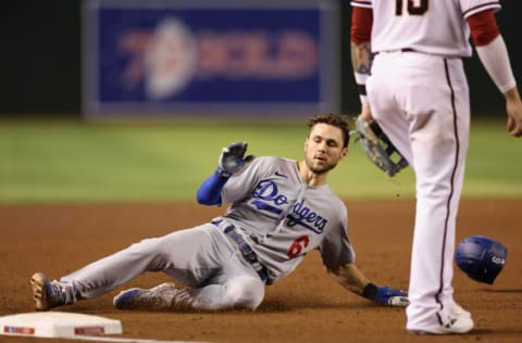 PHOENIX, ARIZONA - SEPTEMBER 12: Trea Turner #6 of the Los Angeles Dodgers slides into third-base after on a triple during the sixth inning of the MLB game against the Arizona Diamondbacks at Chase Field on September 12, 2022 in Phoenix, Arizona. The Dodgers defeated the Diamondbacks 6-0. (Photo by Christian Petersen/Getty Images)