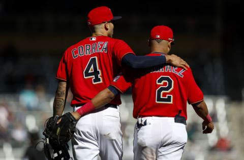 MINNEAPOLIS, MN - SEPTEMBER 29: Carlos Correa #4 and Luis Arraez #2 of the Minnesota Twins embrace in the seventh inning of the game against the Chicago White Sox at Target Field on September 29, 2022 in Minneapolis, Minnesota. The White Sox defeated the Twins 4-3. (Photo by David Berding/Getty Images)