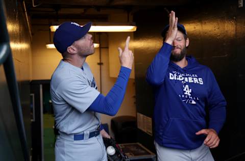 SAN FRANCISCO, CALIFORNIA - AUGUST 02: Freddie Freeman #5 makes hand gestures with Clayton Kershaw #22 of the Los Angeles Dodgers before their game against the San Francisco Giants at Oracle Park on August 02, 2022 in San Francisco, California. (Photo by Ezra Shaw/Getty Images)