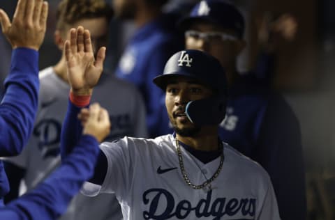 LOS ANGELES, CALIFORNIA - OCTOBER 01: Mookie Betts #50 of the Los Angeles Dodgers celebrates with teammates after scoring off of a single from Freddie Freeman #5 against the Colorado Rockies during the third inning at Dodger Stadium on October 01, 2022 in Los Angeles, California. (Photo by Michael Owens/Getty Images)