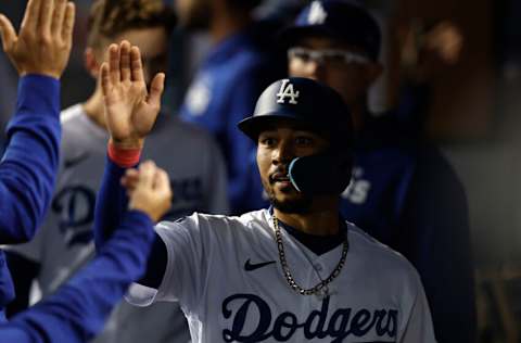 LOS ANGELES, CALIFORNIA - OCTOBER 01: Mookie Betts #50 of the Los Angeles Dodgers celebrates with teammates after scoring off of a single from Freddie Freeman #5 against the Colorado Rockies during the third inning at Dodger Stadium on October 01, 2022 in Los Angeles, California. (Photo by Michael Owens/Getty Images)