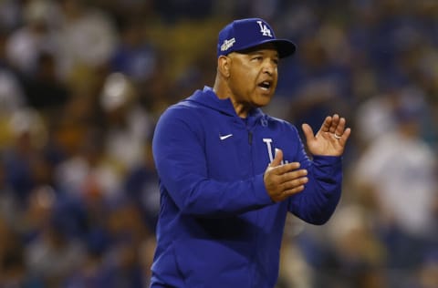 LOS ANGELES, CALIFORNIA - OCTOBER 11: Manager Dave Roberts #30 of the Los Angeles Dodgers claps as he pulls Alex Vesia #51 from the mound in the eighth inning in game one of the National League Division Series against the San Diego Padres at Dodger Stadium on October 11, 2022 in Los Angeles, California. (Photo by Ronald Martinez/Getty Images)